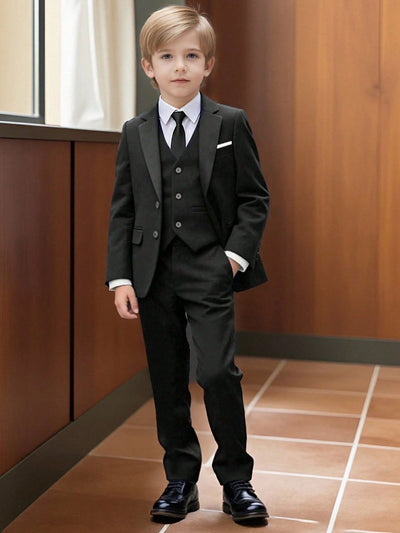 Boy wearing complete formal blazer and trousers suit for weddings